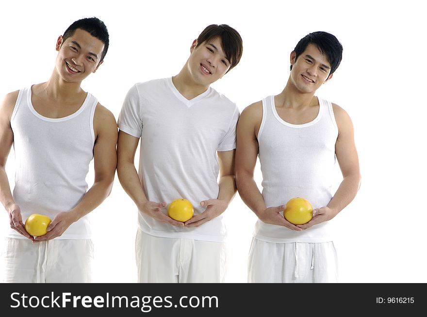Three young man holding grapefruit. Three young man holding grapefruit