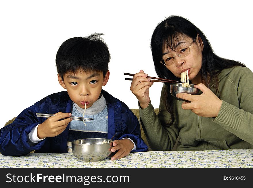 Mother and son with plate of vermicelli. Mother and son with plate of vermicelli