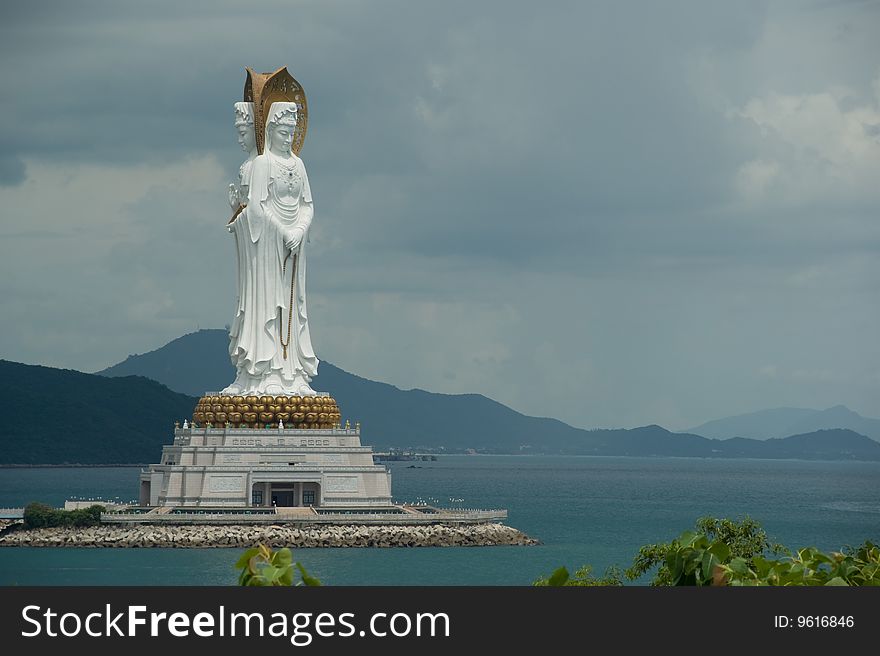 Enormous statue Budda on background storm sky
