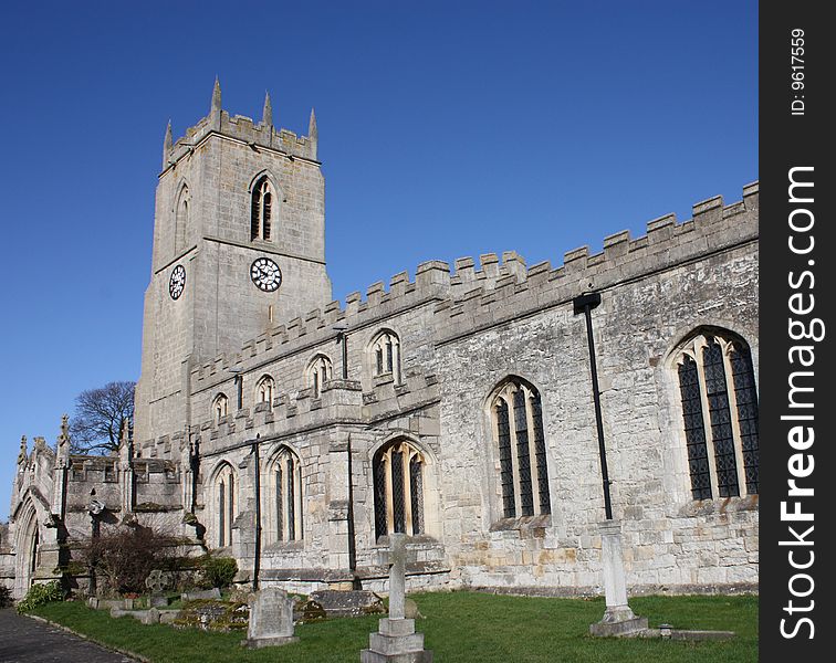 An English Village Church on a Sunny Day. An English Village Church on a Sunny Day.