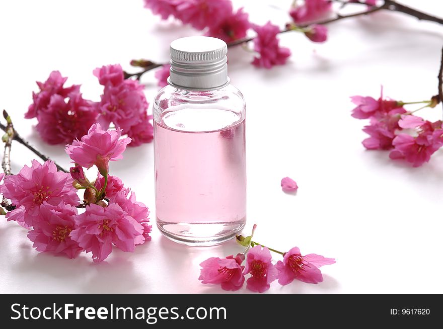 Beautiful red flowers and spa liquid. Beautiful red flowers and spa liquid