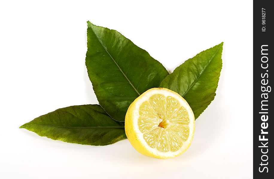 Lemon with leaves on white background. Lemon with leaves on white background