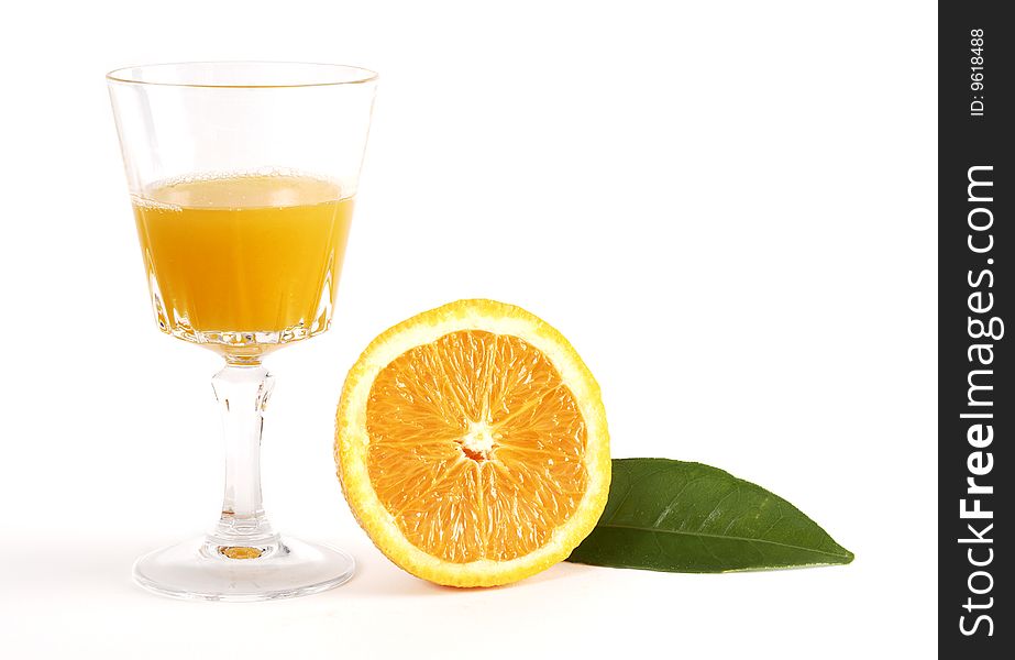 Orange juice in glass with sliced orange