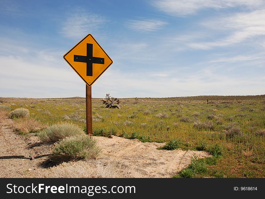 Yellow traffic sign in desert. Yellow traffic sign in desert