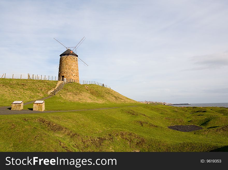 Traditional windmill in the Scottish coast, near Crail