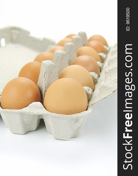 Free range eggs isolated against a white background