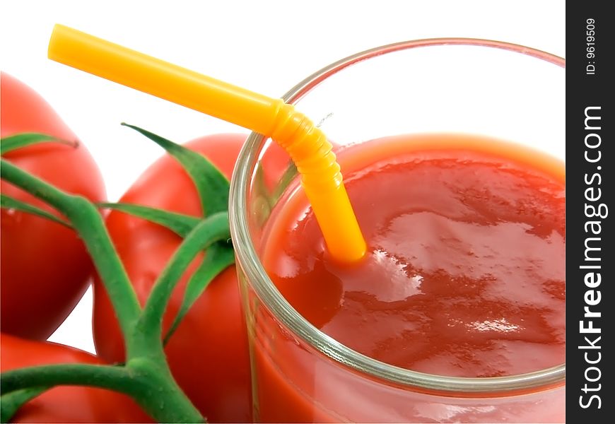 Tomato juice and tomato close-up on a white background