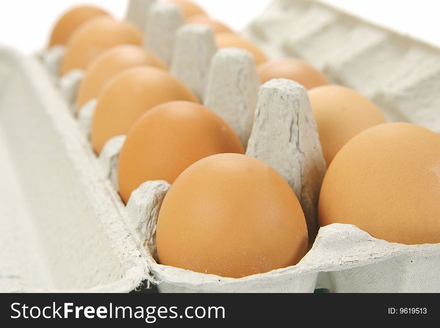 Free range eggs isolated against a white background