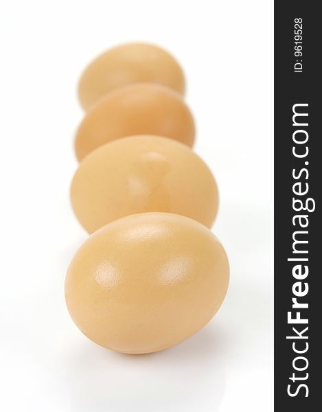 Free range eggs isolated against a white background
