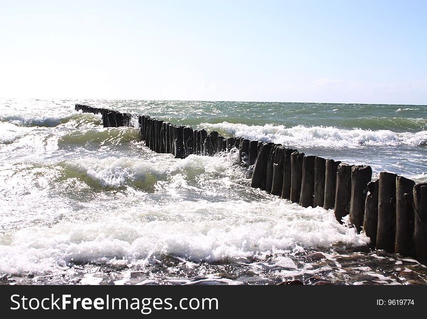 Breakwater braking the waves of the Baltic Sea at the northern German coast