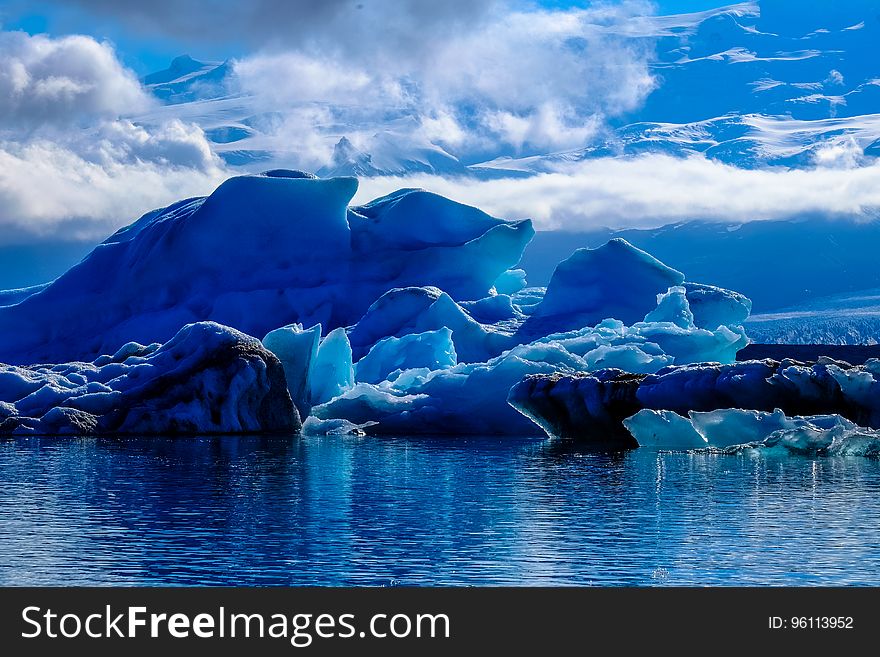 A glacial ice formation on the shore of the sea.