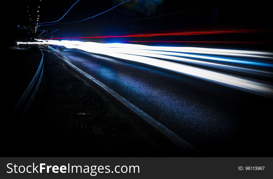 Streaks of white and red lights from cars at night. Streaks of white and red lights from cars at night.