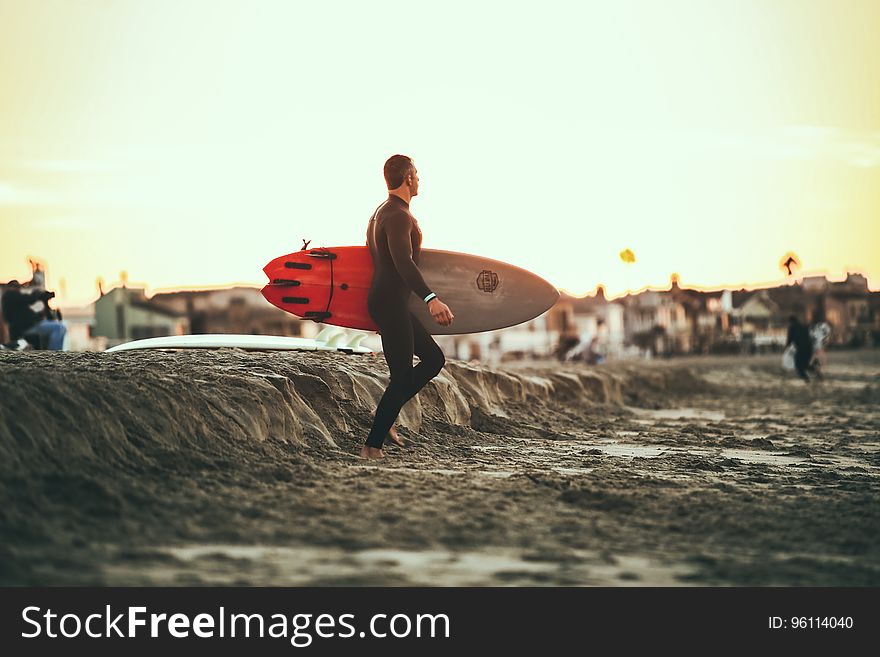 A surfer about to hit the waves.