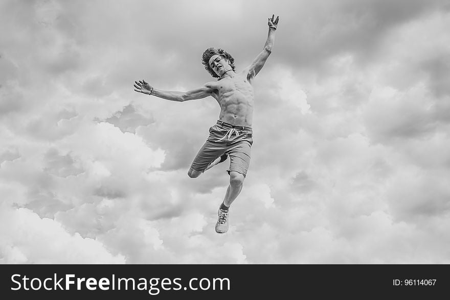 A black and white photo of a man falling from the sky. A black and white photo of a man falling from the sky.