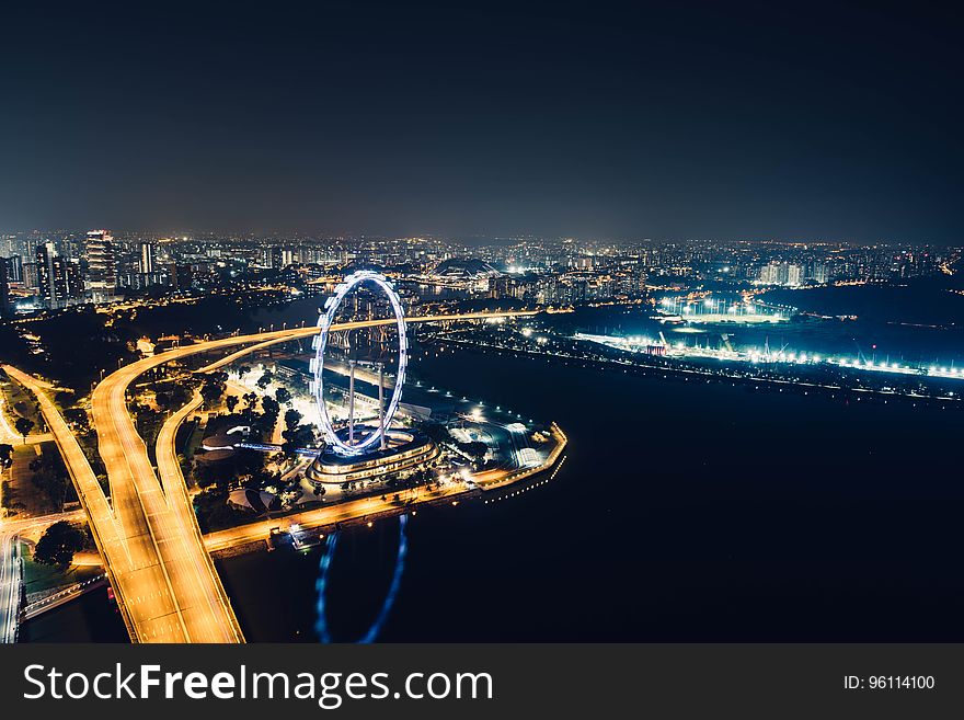 Singapore skyline and the Singapore Flyer at night. Singapore skyline and the Singapore Flyer at night.