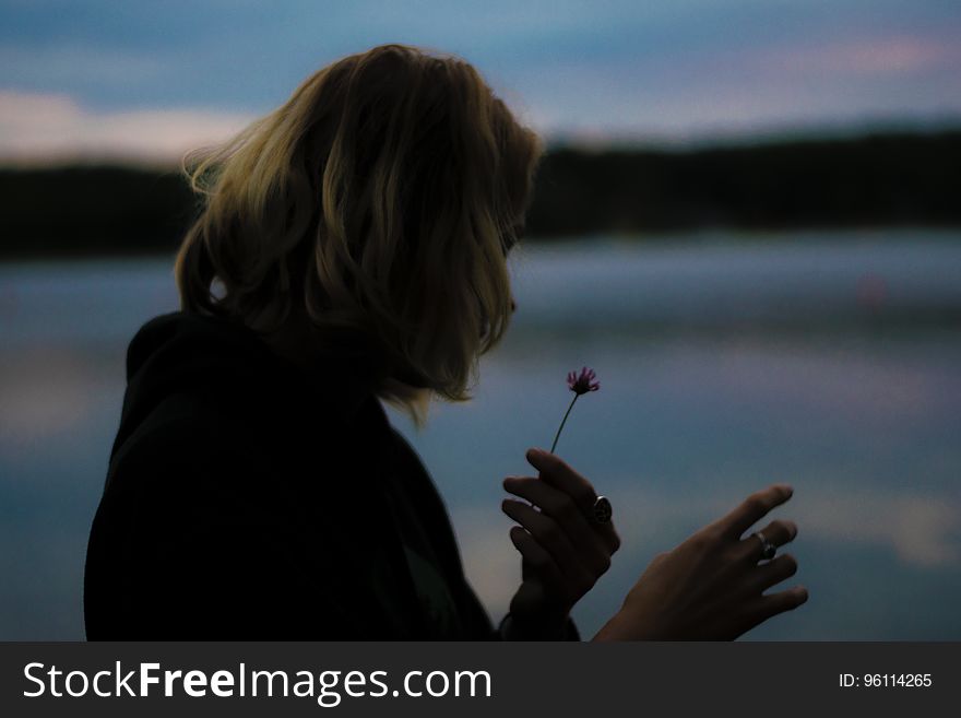 Girl Looking At Flower