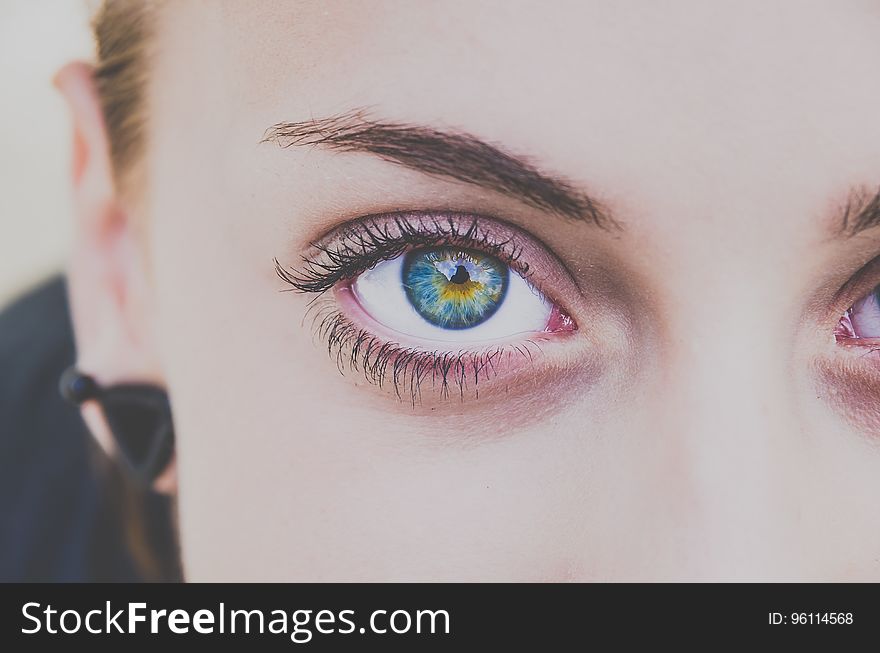 A closeup of a young woman's face. A closeup of a young woman's face.