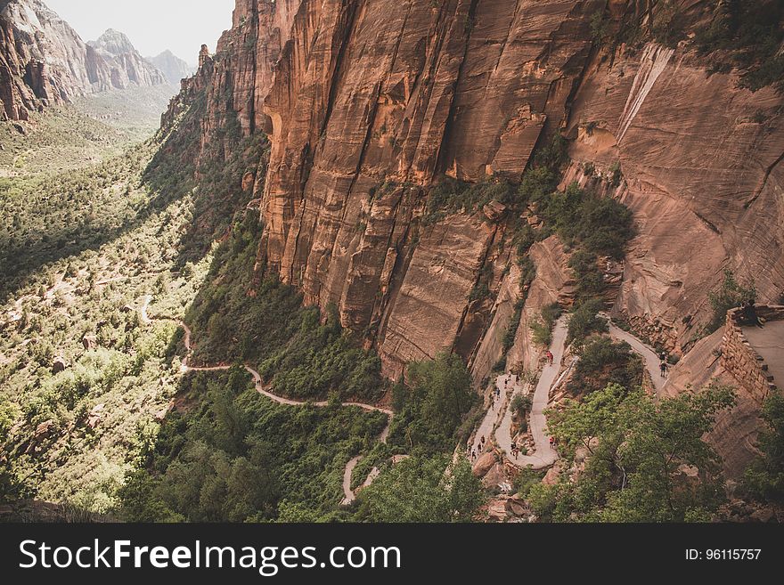 Aerial View Photo Of Brown And Green Cliff With Green Plants During Daytime