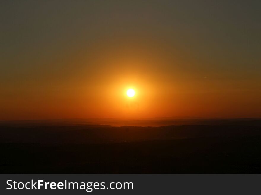 A sunset occurs when the sun descends below the horizon and the light of the day slowly fades. This photo was taken over the city. Location. Iasi, Romania. A sunset occurs when the sun descends below the horizon and the light of the day slowly fades. This photo was taken over the city. Location. Iasi, Romania.