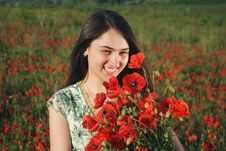 Girl On A Red Poppies Field Royalty Free Stock Photos