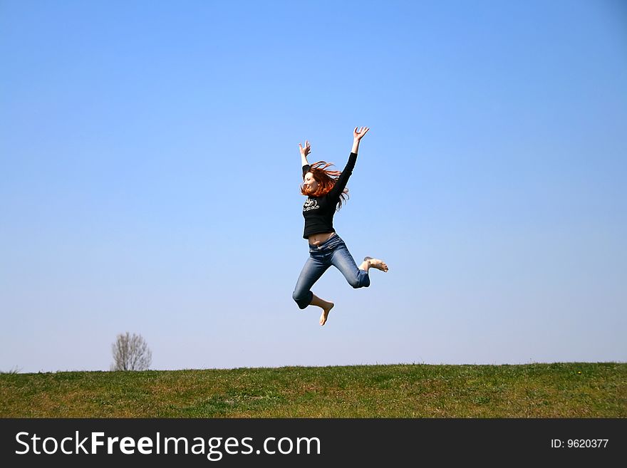 The girl taken in a jump like hanging in the air. The girl taken in a jump like hanging in the air