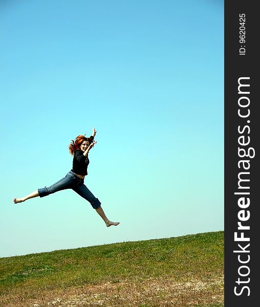 The girl taken in a jump like hanging in the air. The girl taken in a jump like hanging in the air