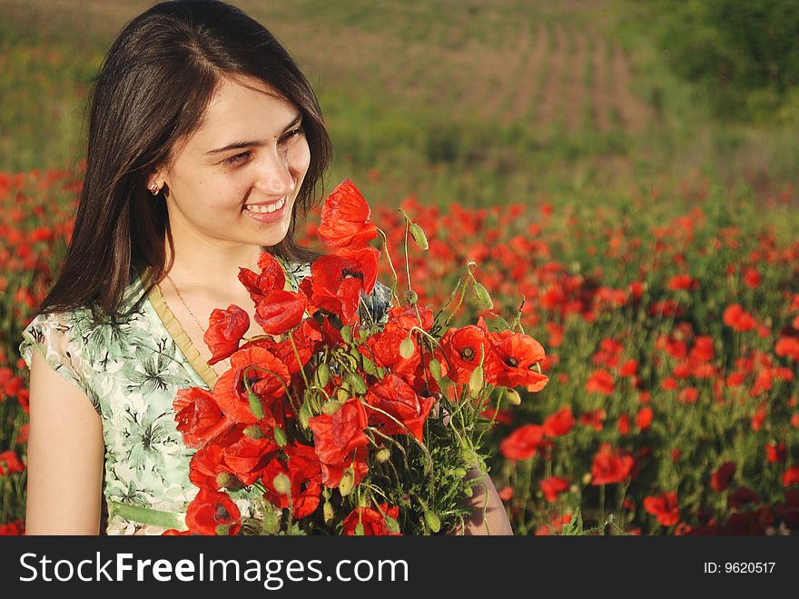 Girl on a red poppies field