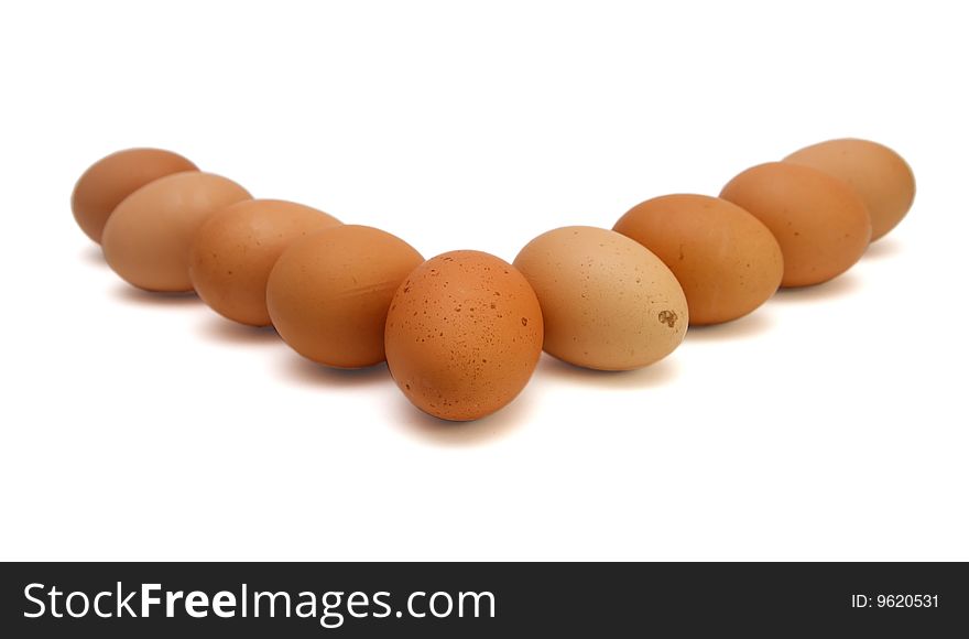 Wedge of nine brown eggs isolated. Wedge of nine brown eggs isolated