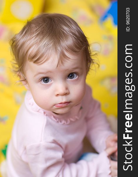 Little girl playing on the floor - shallow DOF