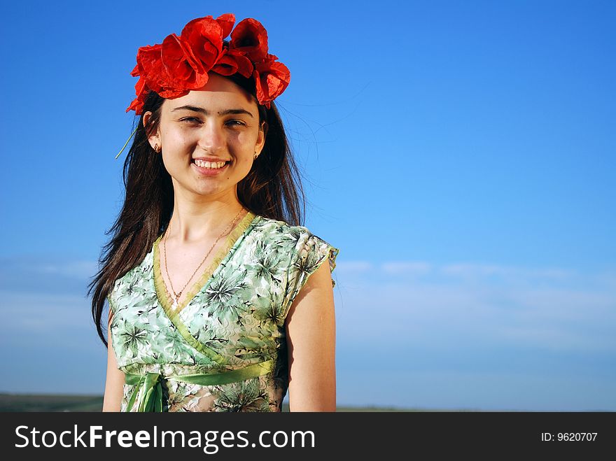 Girl On A Red Poppies Field