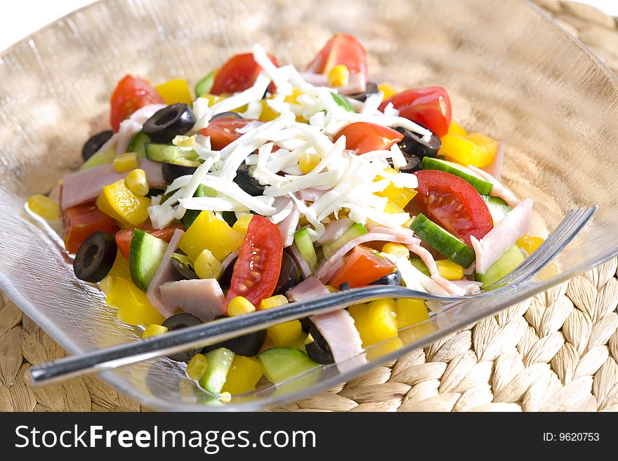 Vegetable salad with cheese and ham. Vegetable salad with cheese and ham