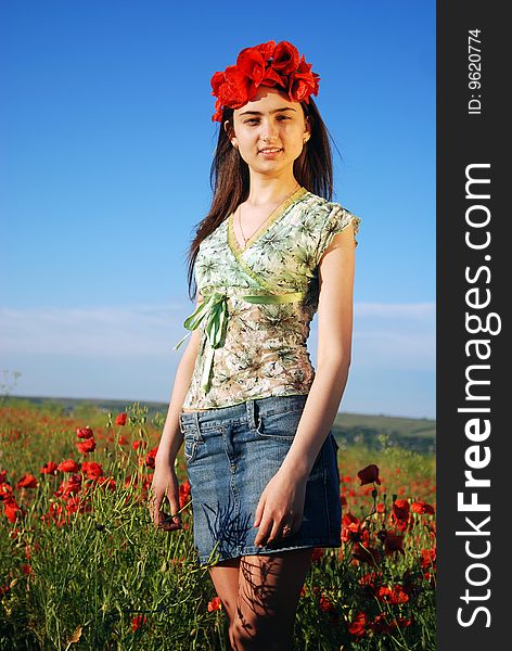 Girl On A Red Poppies Field