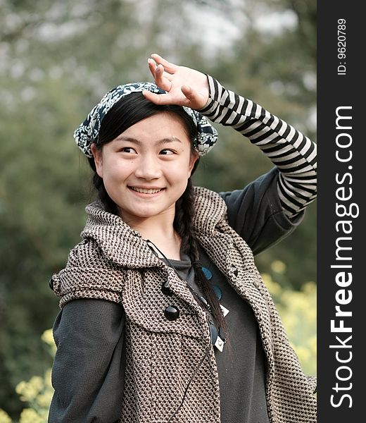 Beautiful smiling woman in the outdoor garden in Asia. Beautiful smiling woman in the outdoor garden in Asia