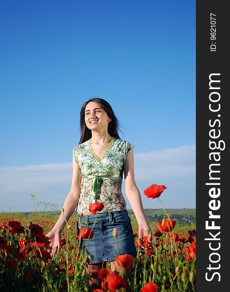 Girl On A Red Poppies Field