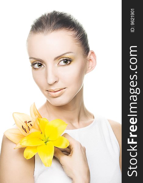 Portrait of young woman with yellow flowers