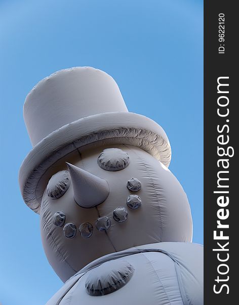 A close-up of a large inflatable snowman