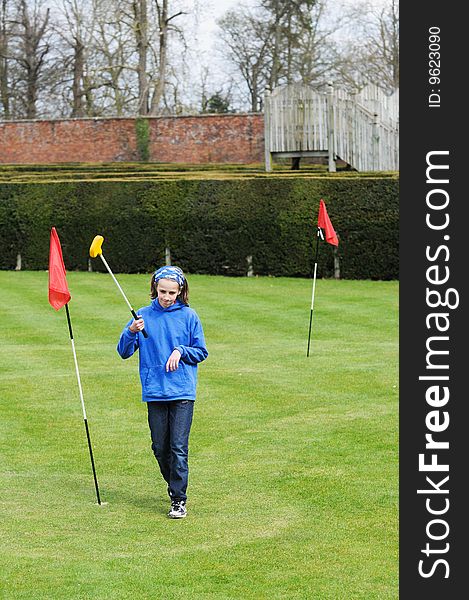 Girl Playing Mini Golf