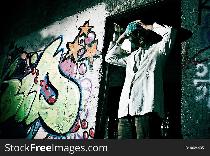 mad scientist in an abandoned warehouse, holds the head