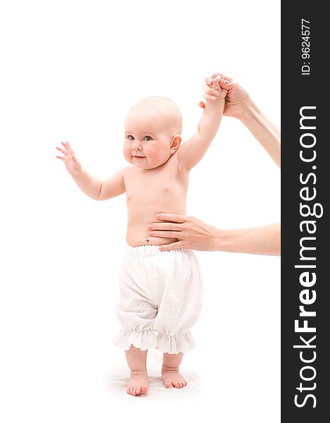 Cute happy baby girl with mother hands on white background