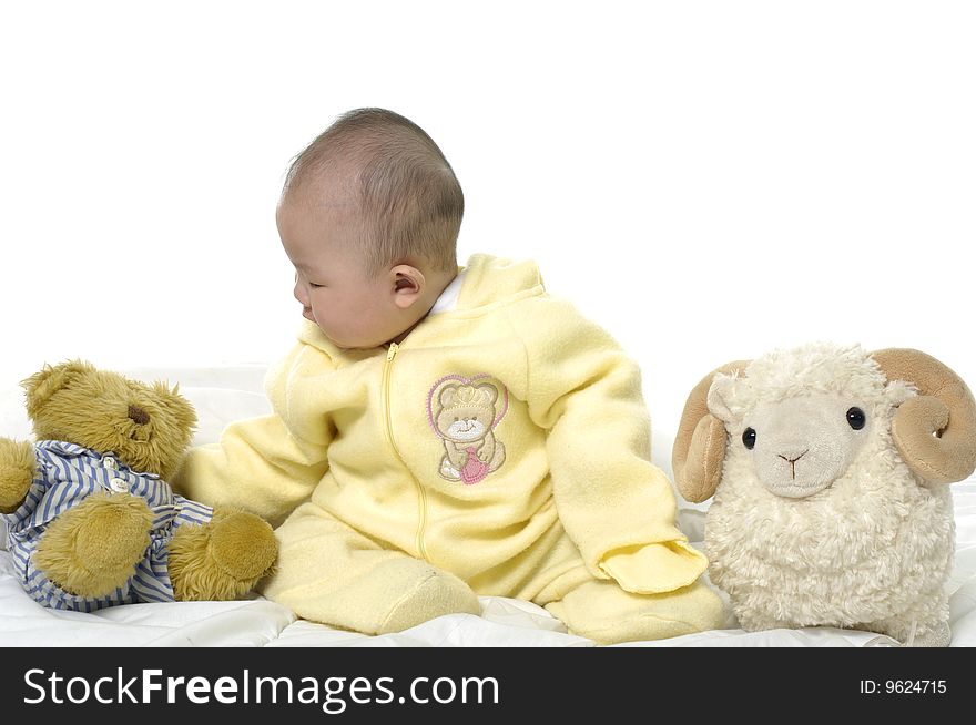 Baby with bear toys and sheep. Baby with bear toys and sheep