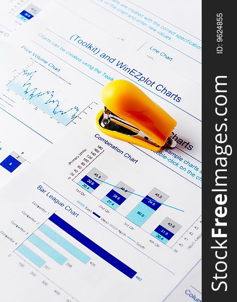 Small nice yellow stapler and charts. Small nice yellow stapler and charts