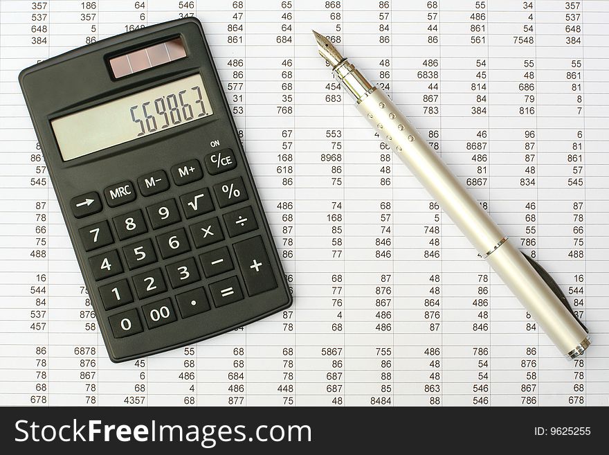 Calculator and pen on a white background. Calculator and pen on a white background