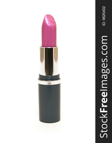 Single pink lipstick with the lid off on a white background