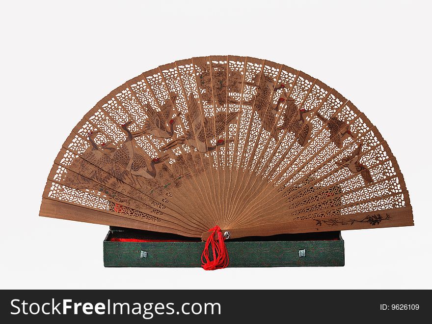 Wooden Chinese patterned fan isolated on white background