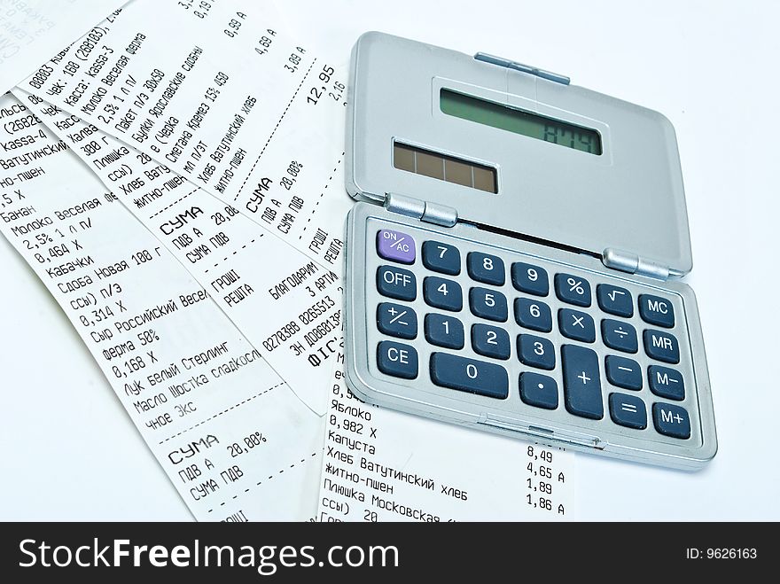 Many bills and calculator on the white background