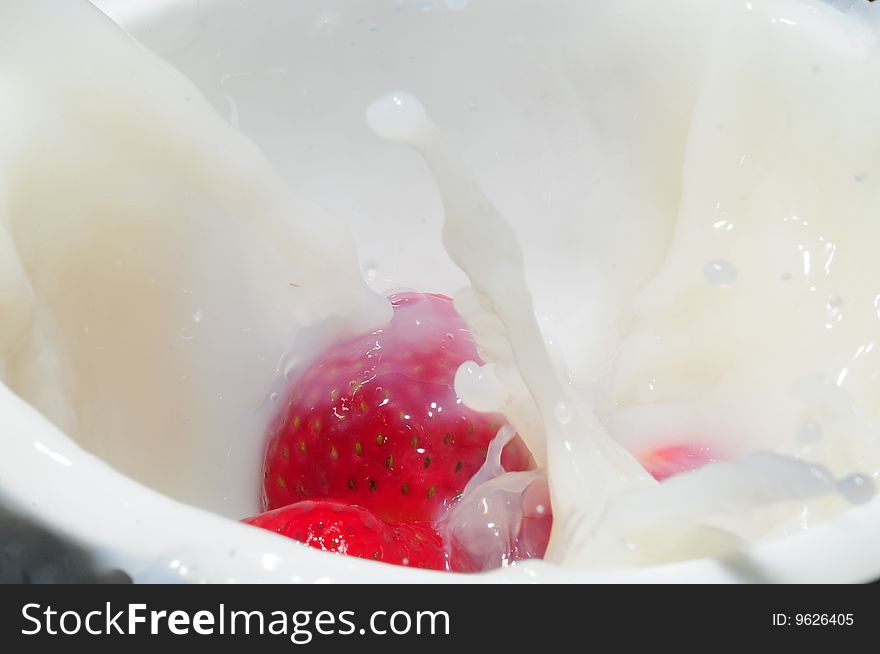 Strawberry splashing in milk for breakfast