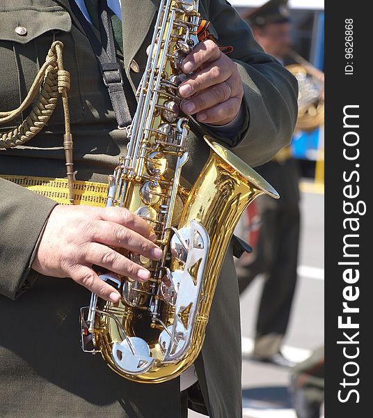 Color photo of a military musician with saxophones