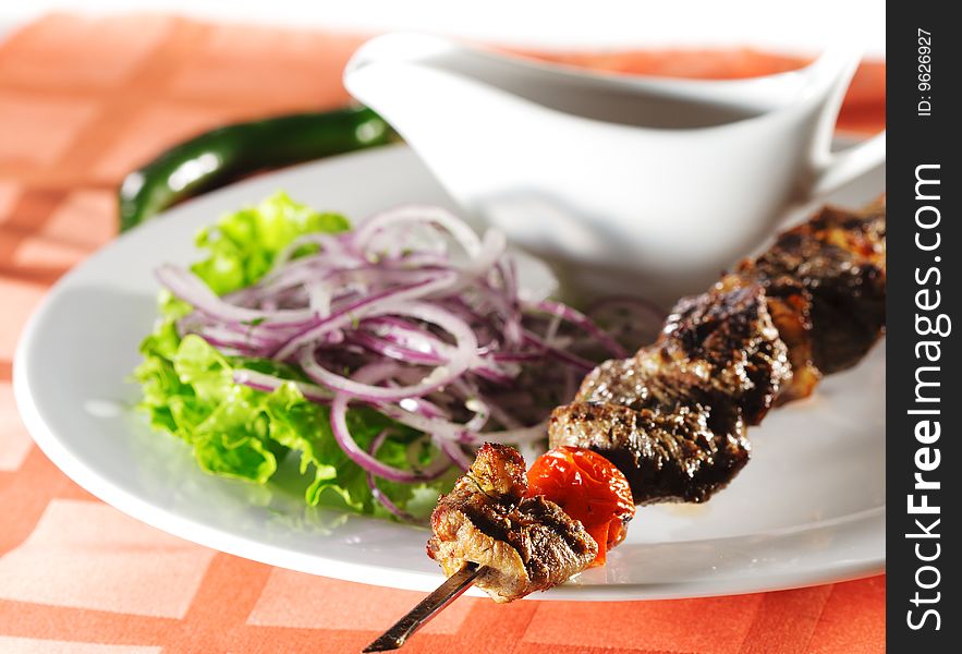 Hot Meat Dish - Grilled Lamb with Onions Salad and Sauce. Hot Meat Dish - Grilled Lamb with Onions Salad and Sauce