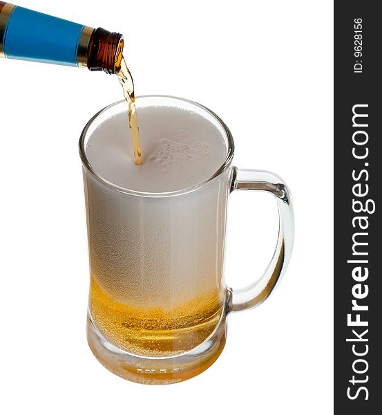 Glass of beer close-up with bottle isolated on white background