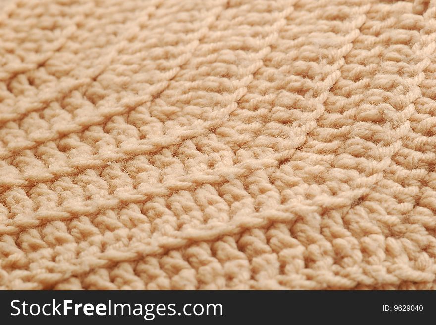 Close up of beige knit pattern.